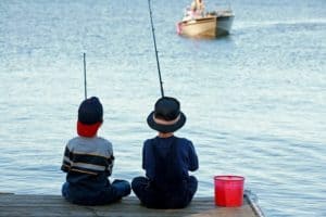 Boys fishing on a dock