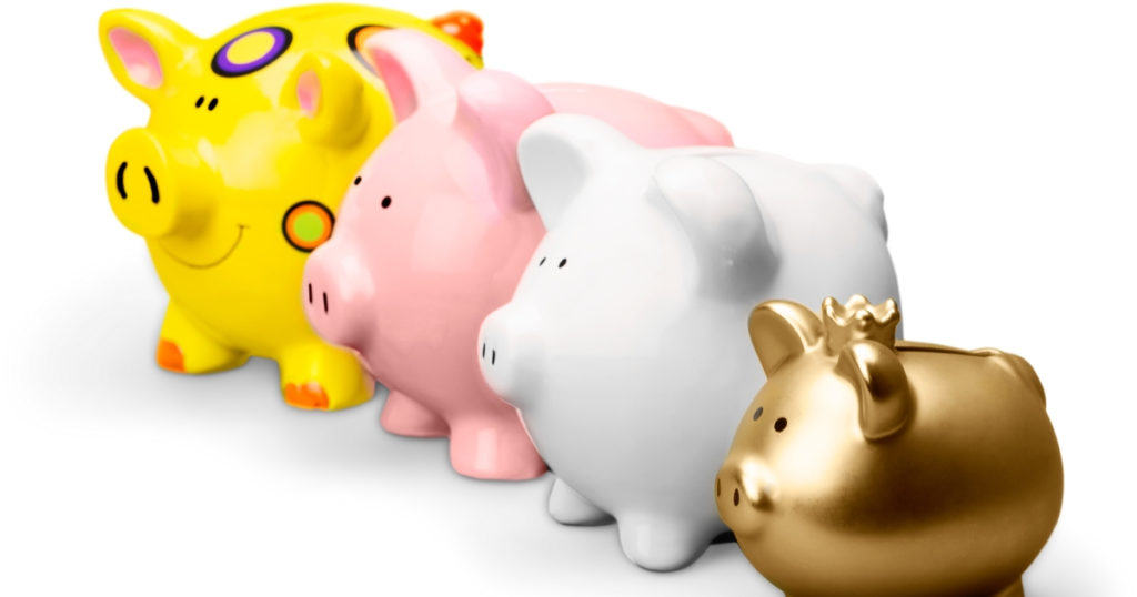 four different piggy banks lined up for family budget meeting