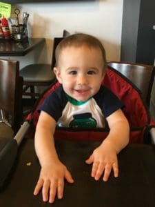 Baby in high chair at cafe