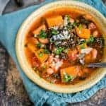 Rustic vegetable stew with butternut squash, tomatoes, beans and kale