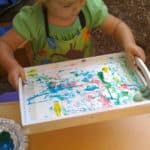 Rolling rock painting in tray