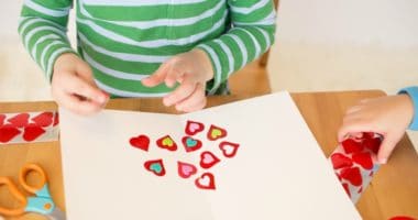 Awesome Valentine's activities for kids - Child making Valentine's cards