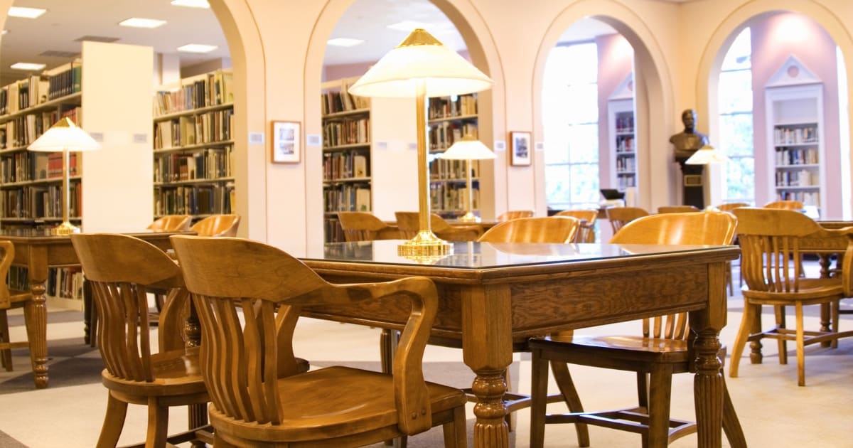 Desks in a library where you can learn more about what libraries offer