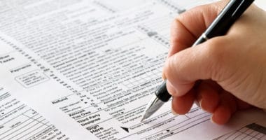 signing tax documents to prepare to file taxes