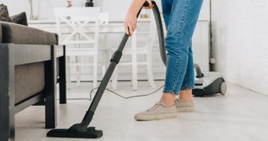 mom vacuuming and spring cleaning