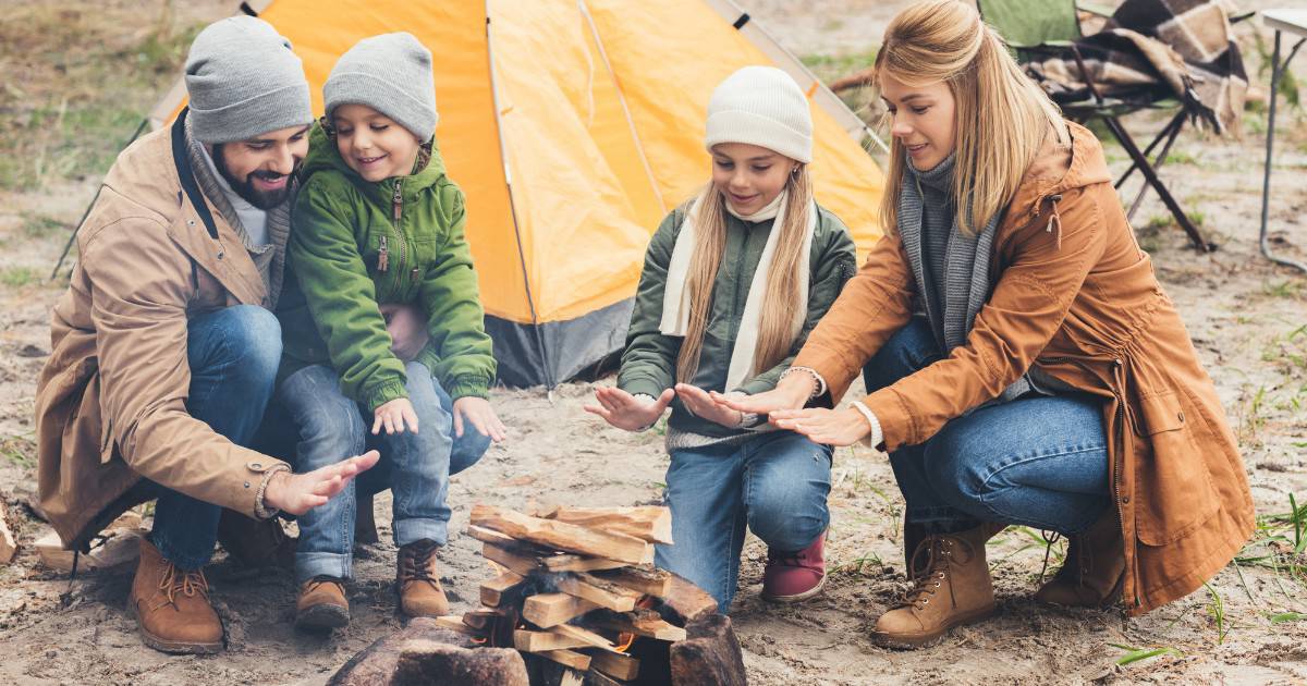 camping with young children around campfire